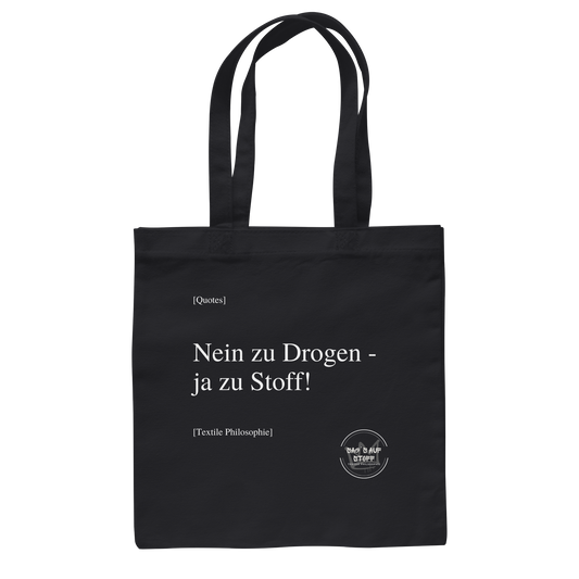 Schwarzer Jutebeutel mit weißer Aufschrift "Nein zu Drogen - ja zu Stoff" und Logo "Sag´s auf Stoff"