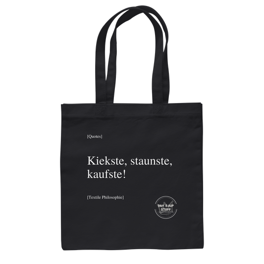 Schwarzer Jutebeutel mit weißer Aufschrift "Kiekste, staunste, kaufste" und Logo "Sag´s auf Stoff"