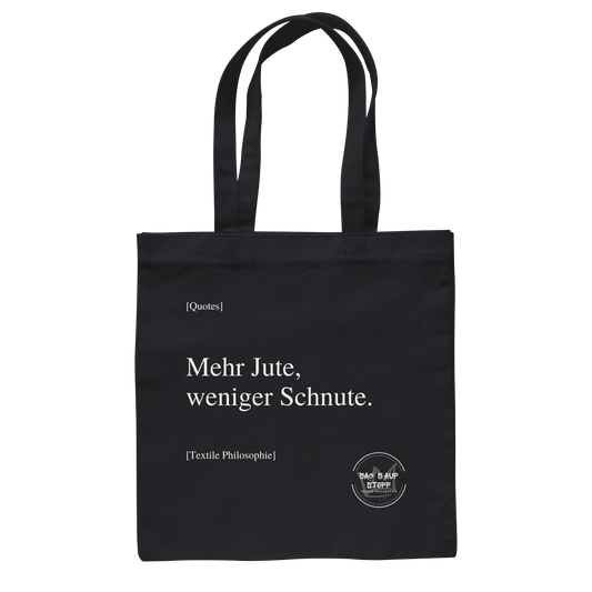 Schwarzer Jutebeutel mit weißer Aufschrift "Mehr Jute, weniger Schnute." und Logo "Sag´s auf Stoff"