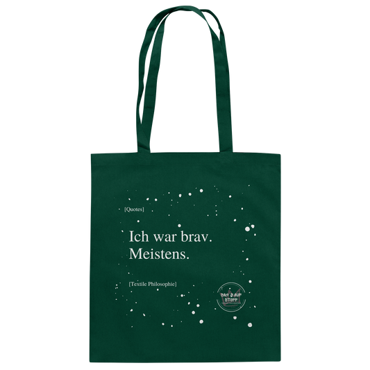 Grüner Jutebeutel von „Sag’s auf Stoff“ mit weißer Aufschrift "Ich war brav. Meistens.", Weißen Schneeflocken im Hintergrund und Logo "Sag´s auf Stoff". Perfekt als Geschenk.