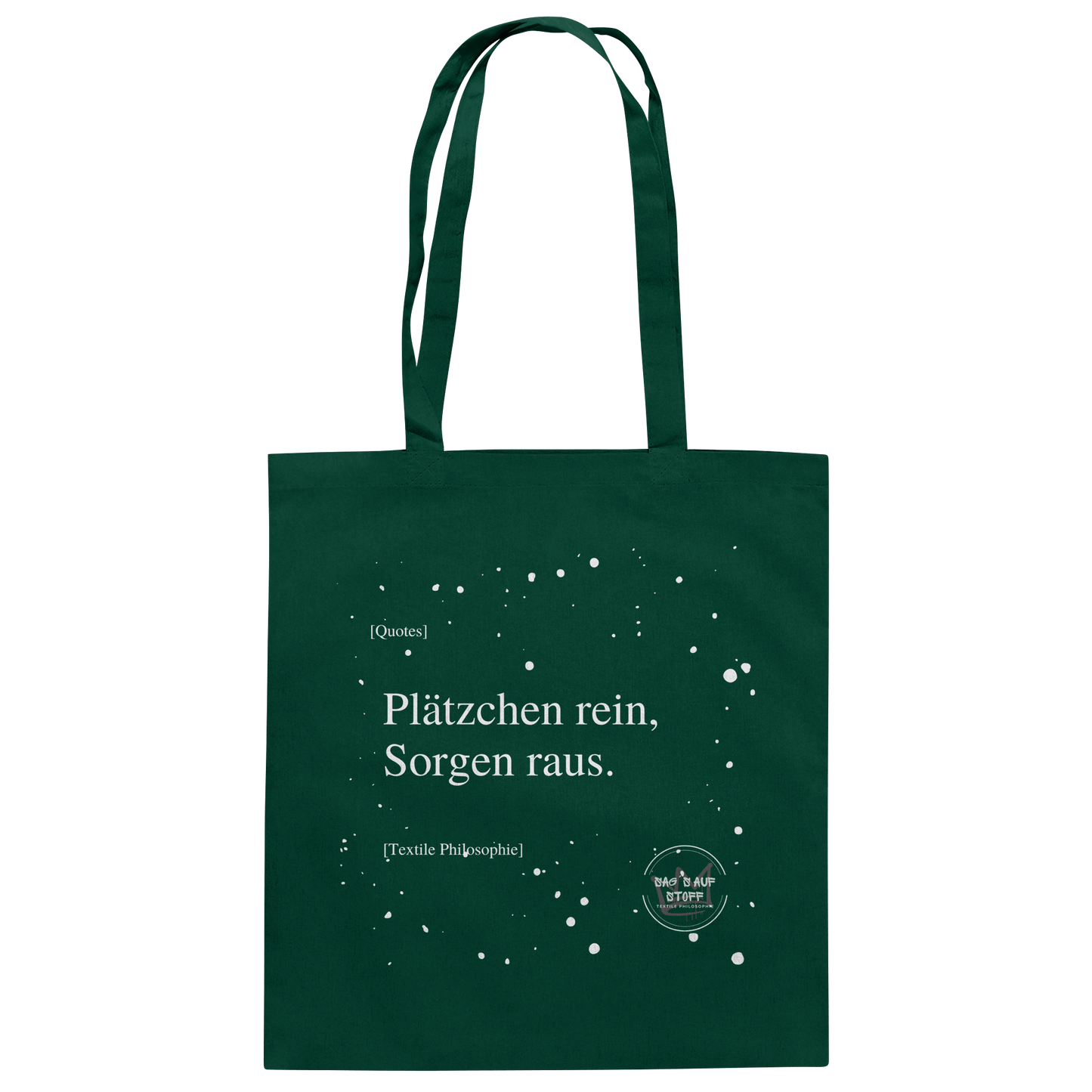Grüner Jutebeutel von „Sag’s auf Stoff“ mit weißer Aufschrift "Plätzchen rein, Sorgen raus.", Weißen Schneeflocken im Hintergrund und Logo "Sag´s auf Stoff". Perfekt als Geschenk.