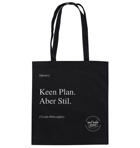 Schwarzer Jutebeutel mit weißer Aufschrift "Keen Plan. Aber Stil." und Logo "Sag´s auf Stoff"