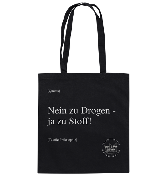 Schwarzer Jutebeutel mit weißer Aufschrift "Nein zu Drogen - ja zu Stoff!" und Logo "Sag´s auf Stoff"