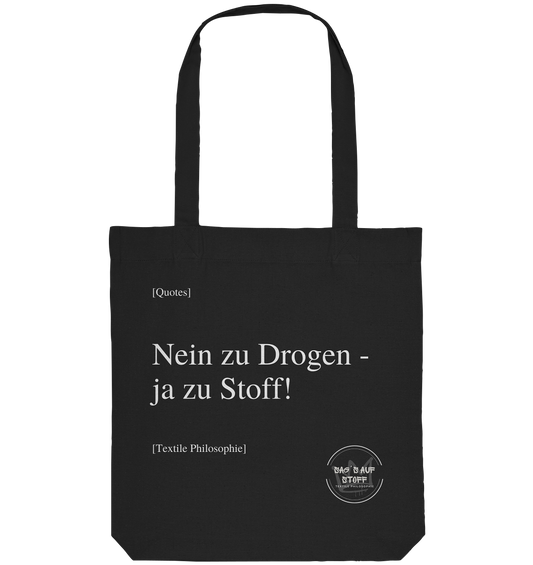 Schwarzer Jutebeutel mit weißer Aufschrift "Nein zu Drogen - ja zu Stoff!" und Logo "Sag´s auf Stoff"
